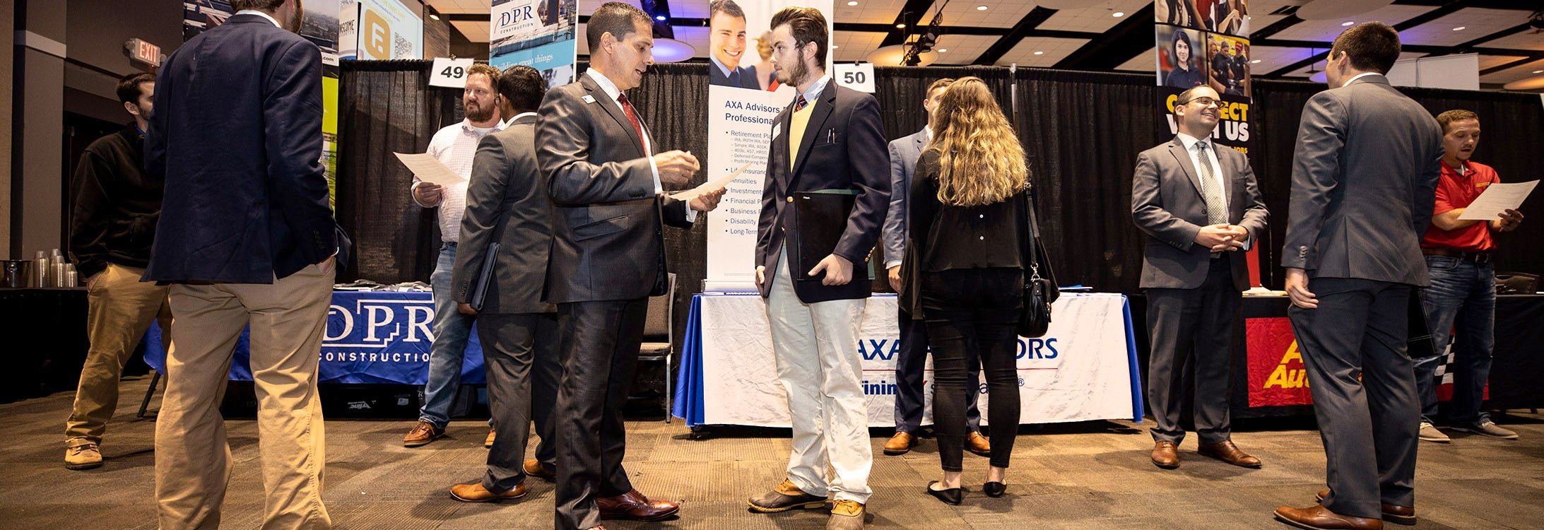 Men and women attending a conference